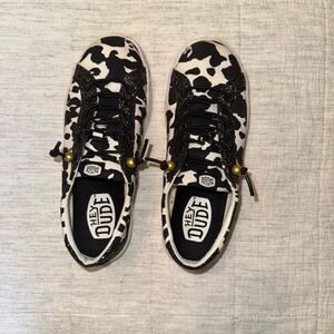 Hey Dude Black and White Cow Print Sneakers